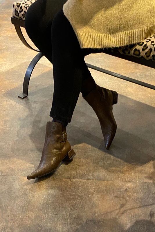 Dark brown women's ankle boots with buckles at the back. Pointed toe. Low flare heels. Worn view - Florence KOOIJMAN